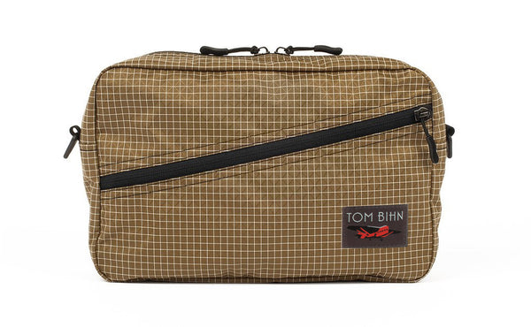 A Packing Cube Shoulder Bag in Coyote (tan with white grid) 200 Halcyon.